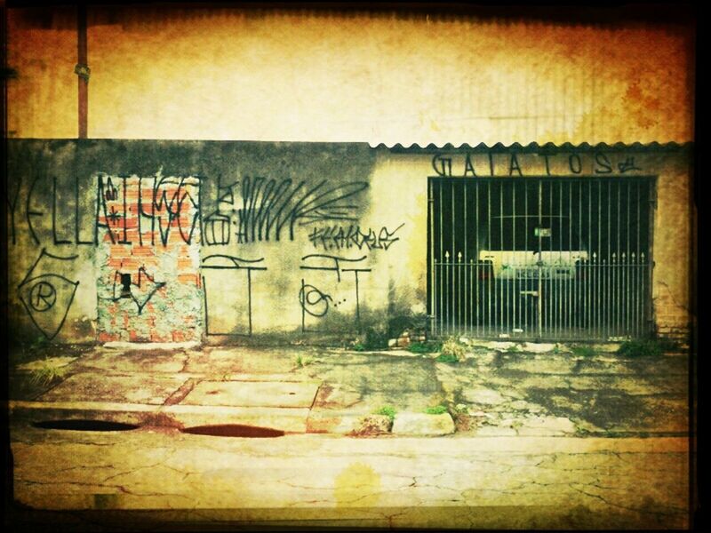 graffiti, built structure, architecture, text, wall - building feature, building exterior, western script, abandoned, damaged, wall, communication, weathered, auto post production filter, transfer print, door, old, run-down, deterioration, obsolete, art