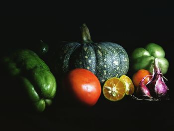 Close-up of pumpkins against black background