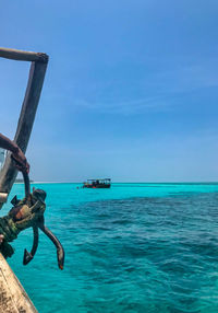 Scenic view of sea against clear blue sky