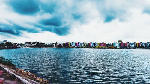 Panoramic view of river and buildings against sky