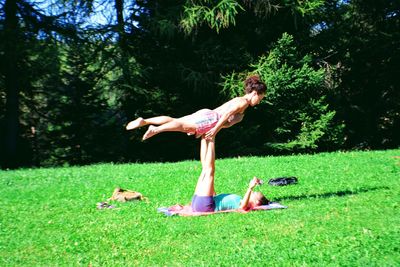 Woman with dog on field