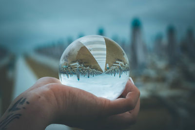 Close-up of person holding glass