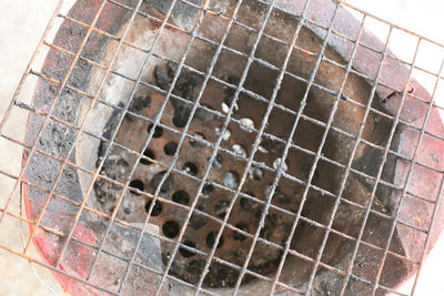 High angle view of dog in cage