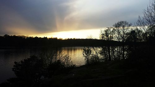 Scenic view of sunset over lake