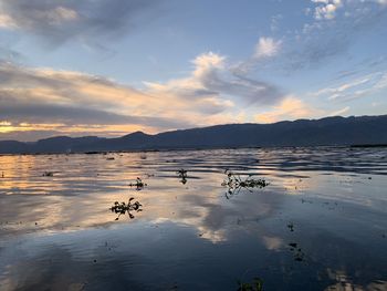 Scenic view of sea against sky at sunset