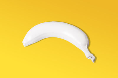 High angle view of bananas against yellow background