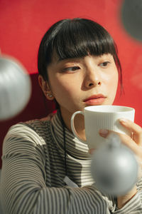 Portrait of boy drinking coffee