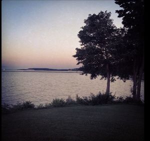 Scenic view of calm lake at sunset