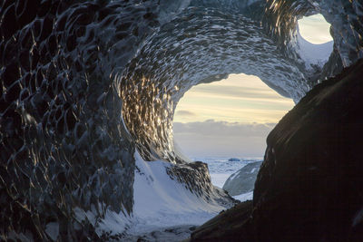 Scenic view of sea against sky during winter