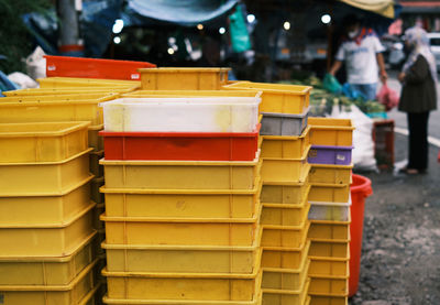 Assorted plastic containers stacked by the roadside of vegetable sellers in cam. highlands, malaysia