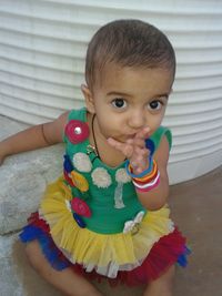 Portrait of cute baby girl with toy