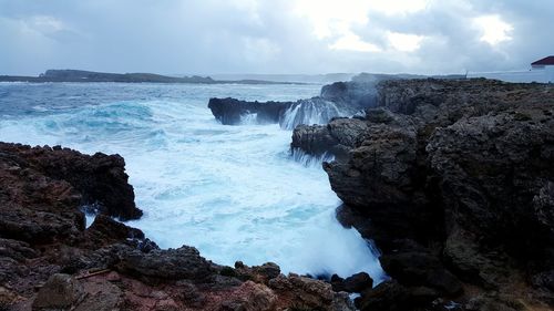 Scenic view of sea against cloudy sky