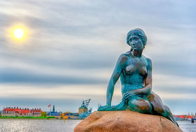 Low angle view of statue against cloudy sky