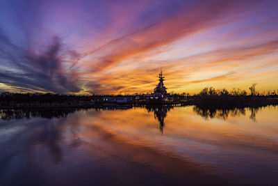 Scenic view of lake against sky during sunset