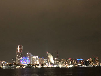 Illuminated buildings in city at night