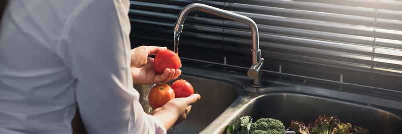 Midsection of man preparing food at home