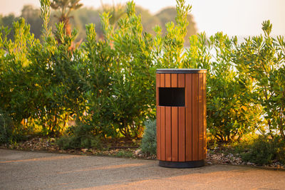 Garbage bin by plant