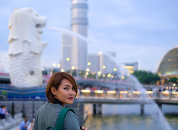 Portrait of woman standing merlion 