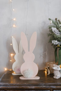 Children's room christmas decor homemade plywood bunnies with soft tails on the dresser