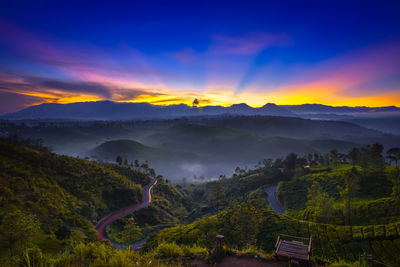 Scenic view of mountains against sky during sunset