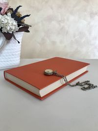 Red and white flowers on table