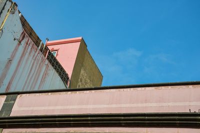 Low angle view of building against blue sky