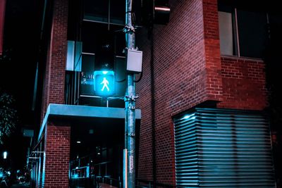 Low angle view of illuminated building at night