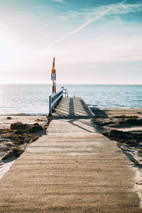 Pier over sea against sky