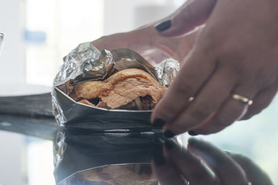 Midsection of woman holding ice cream