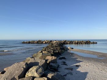 Scenic view of sea against clear blue sky