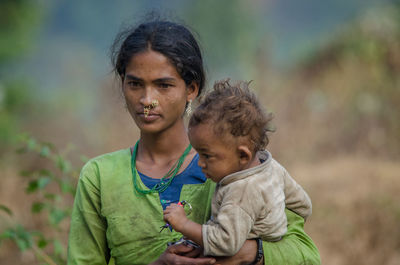 Portrait of mother and daughter outdoors