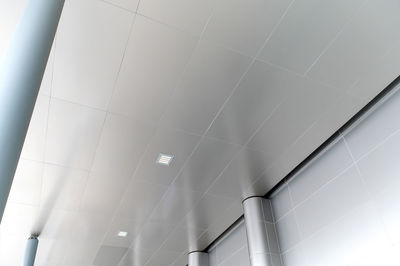 Fluorescent lamp on the modern ceiling