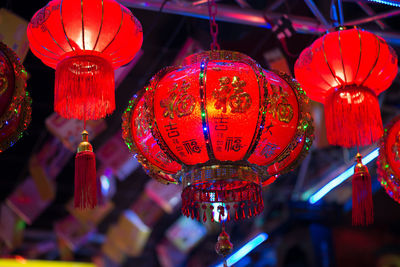 Low angle view of illuminated lanterns hanging in market