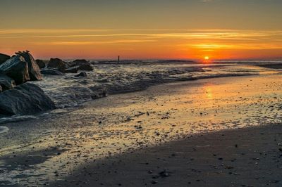 Scenic view of sea at sunset