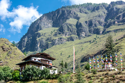 Scenic view of trees and mountains against sky