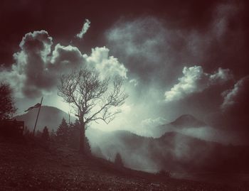 Scenic view of landscape against cloudy sky