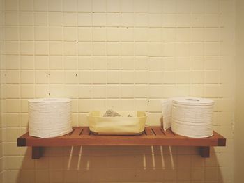 Wicker basket on table against wall