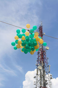 Low angle view of balloons against sky