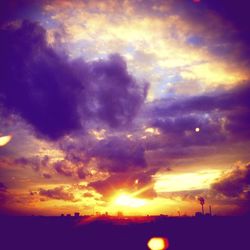 Silhouette of landscape against dramatic sky