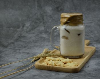 Close-up of drink in glass jar on table