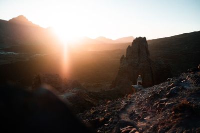 Scenic view of rocky mountains against sky during sunset