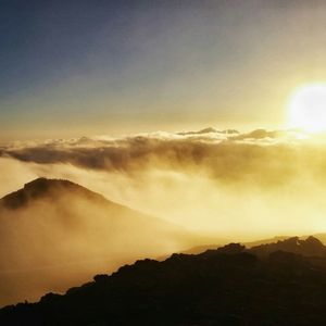 Scenic view of mountains against sky during sunset