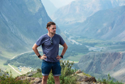 Full length of man standing on mountains