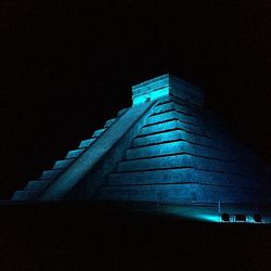 Low angle view of illuminated walkway at night