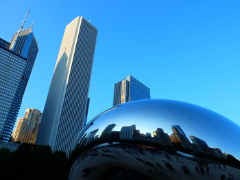 Low angle view of buildings against blue sky