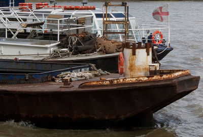 Boats moored at harbor