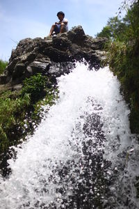 Woman standing on rocks