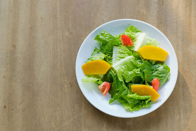 High angle view of salad served on table