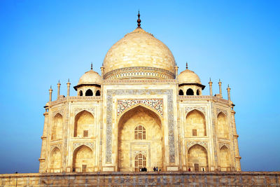 Low angle view of historical building against blue sky