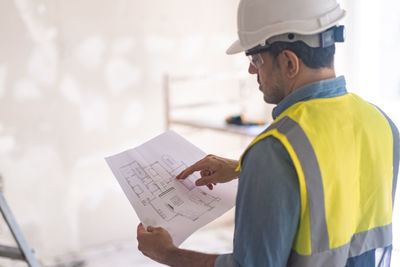 Side view of man working in office